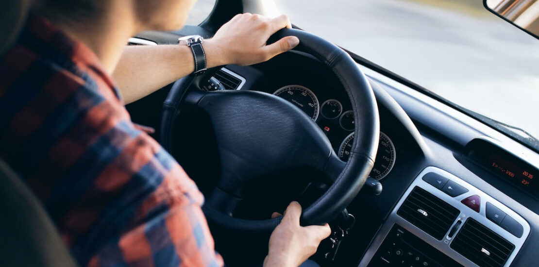 Woman behind the wheel, emphasizing the significance of a restricted license.